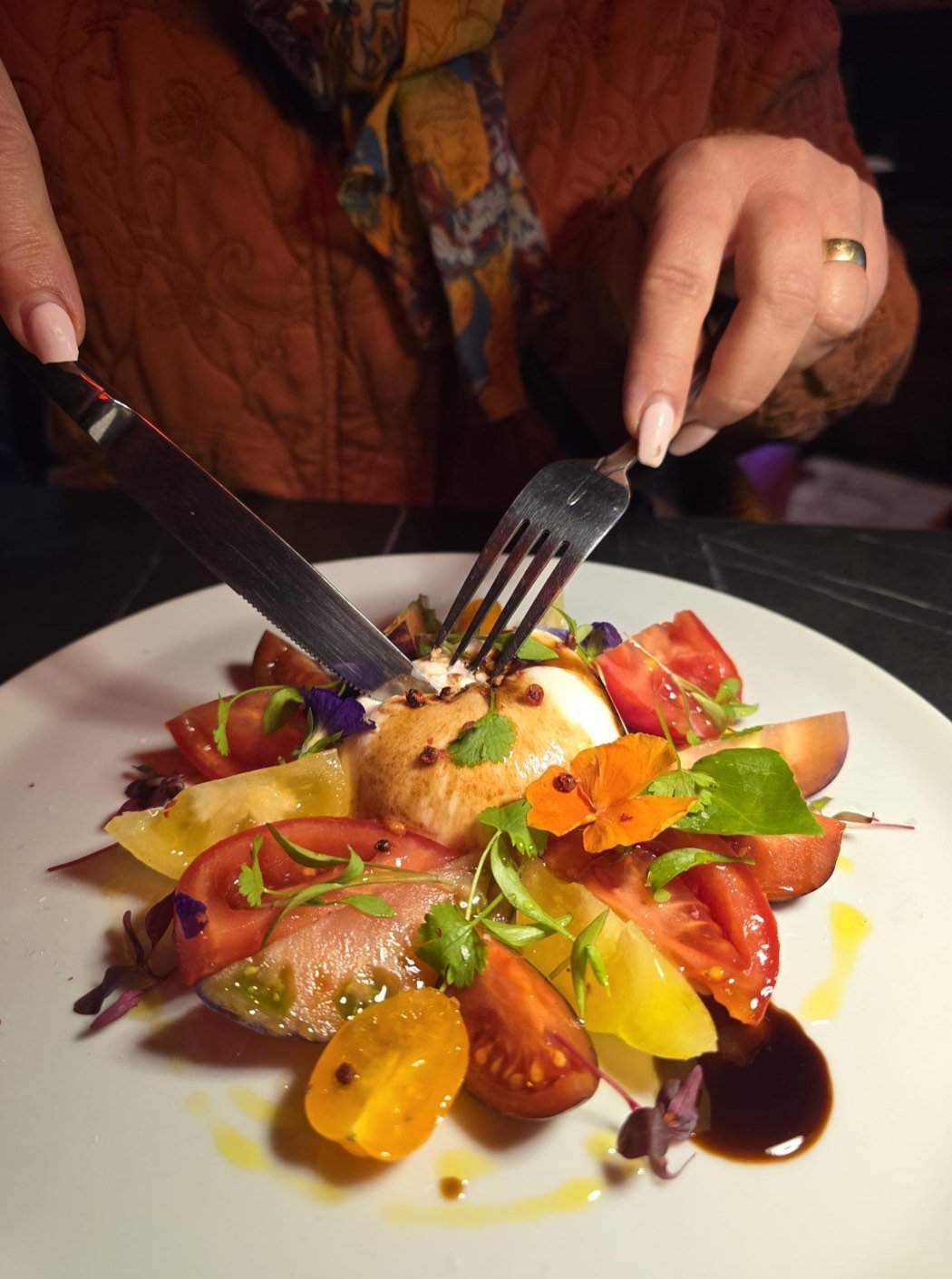 Burrata with Isle of Wight tomatoes, edible flowers and olive oil